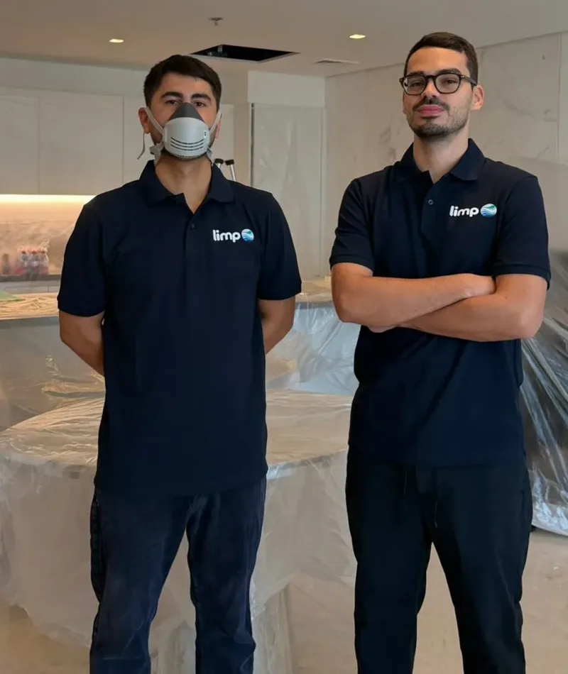 The limpo team on site, with furniture protected before an AC deep clean